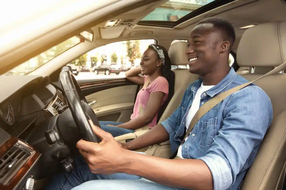 A man driving safely with his eyes on the road. 