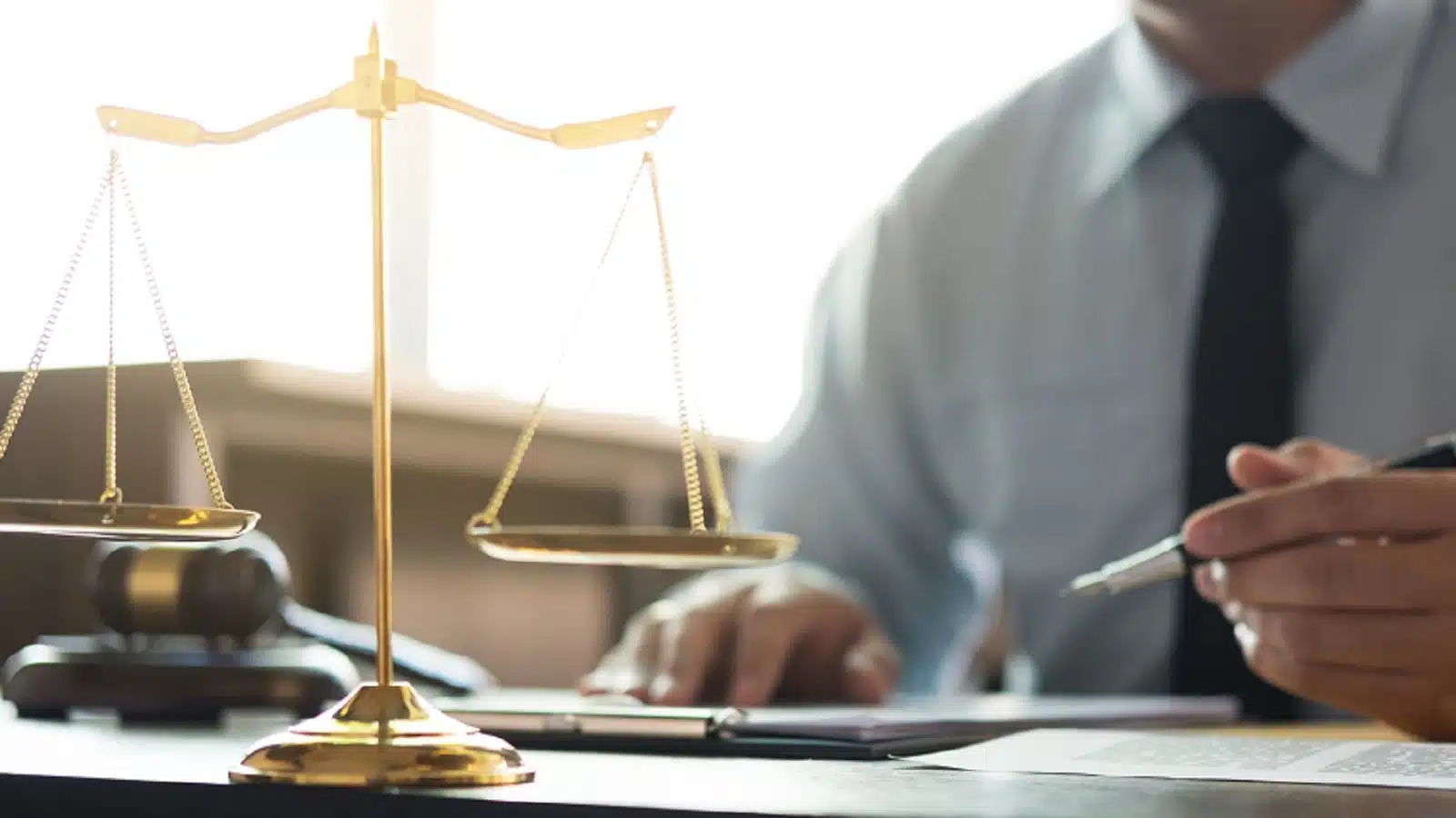 Lawyer Signing A Legal Document In His Office