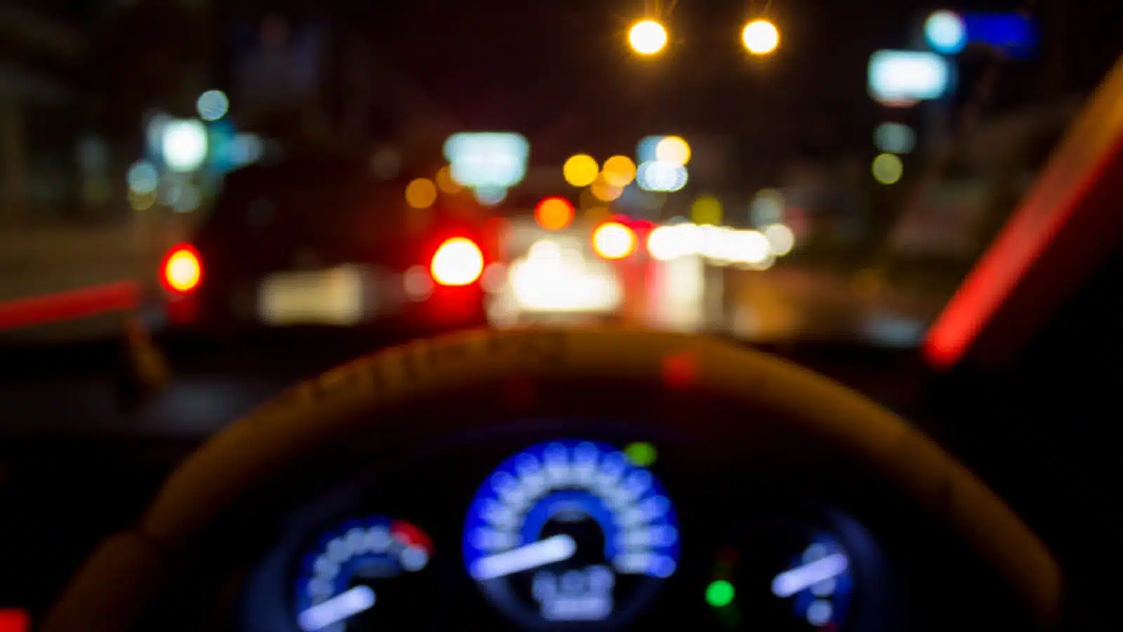 Driving Vehicle At Night Stock Photo