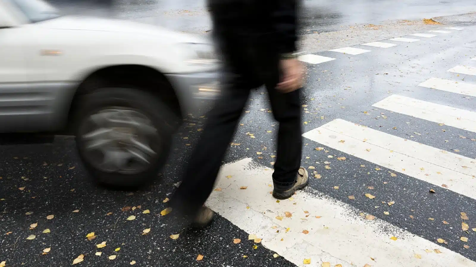 Small SUV Hitting A Pedestrian Stock Photo