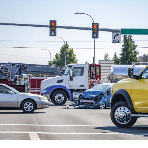 A big truck in Arkansas has caused serious damage to a small car at an intersection.